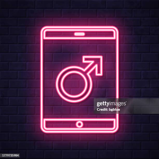 tablet pc with male symbol. glowing neon icon on brick wall background - touch screen wall stock illustrations
