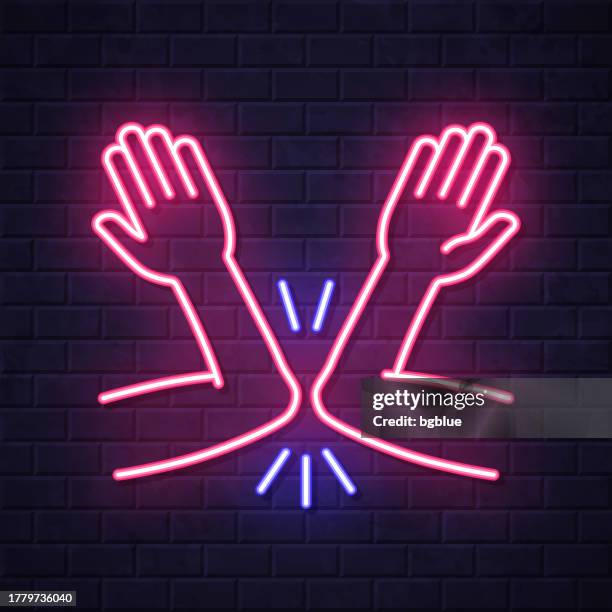greeting with elbow bump. glowing neon icon on brick wall background - elbow bumping stock illustrations