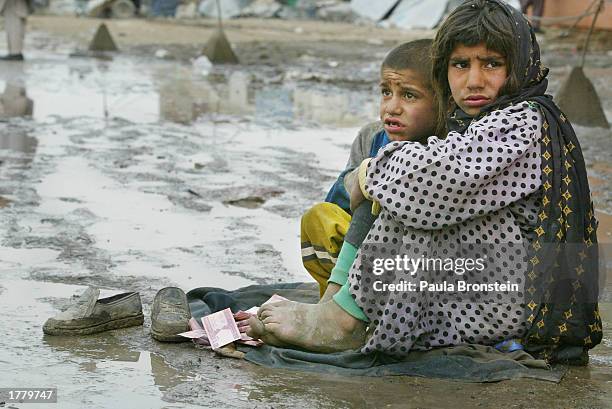 muslim needy beg during festival of sacrifice - afghan girl stock pictures, royalty-free photos & images