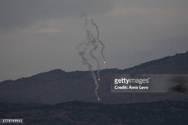 Flares descend over Israel's northern border with Lebanon on November 13, 2023 in Northern Israel, Israel. A month after Hamas's Oct. 7 attacks that...