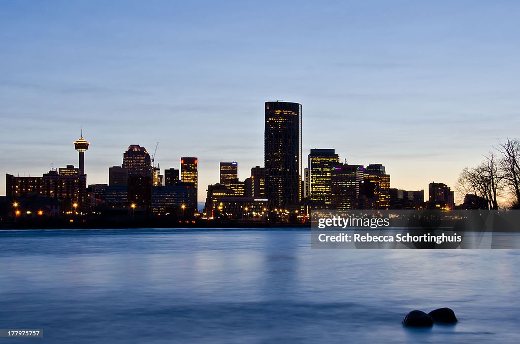 Calgary skyline at dusk over the Bow River