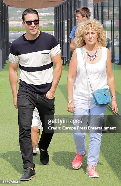 Miguel Angel Silvestre and his mother Maria Lidon attend the final of a charity padel match for Borja Sanchez Foundation on August 25, 2013 in...