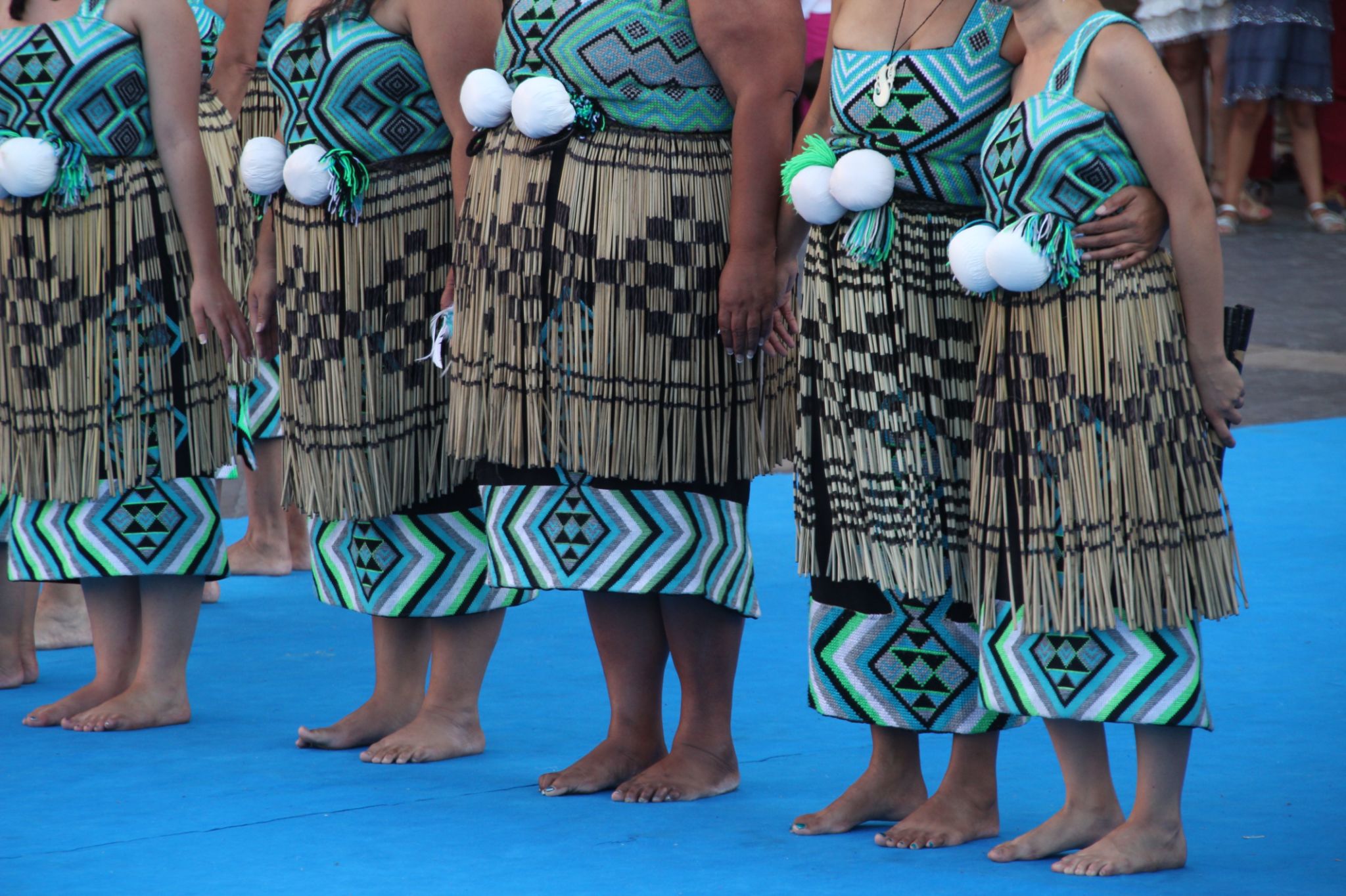 Group of New Zealand Maori folk dancers performing in an outdoor festival. Group of New Zealand Maori folk dancers performing in an outdoor festival.