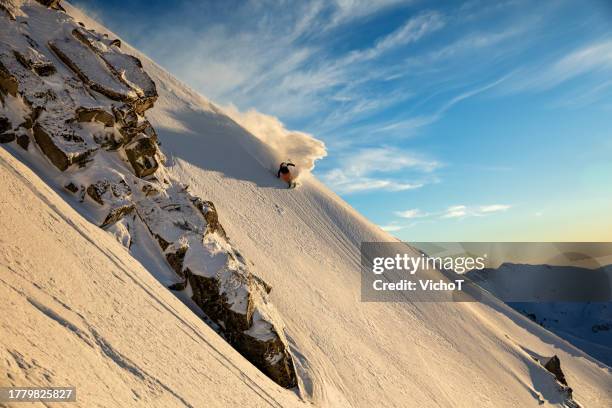 back country skier riding down beautiful mountain slope at sunset - pirin mountains stock pictures, royalty-free photos & images