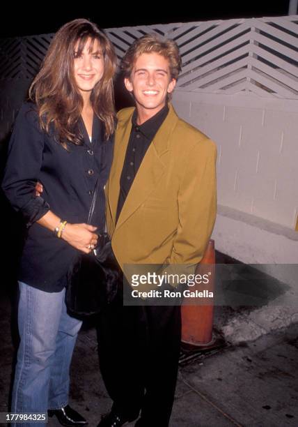 Actress Jennifer Aniston and actor Charlie Schlatter on August 31, 1990 dine at Spago in West Hollywood, California.