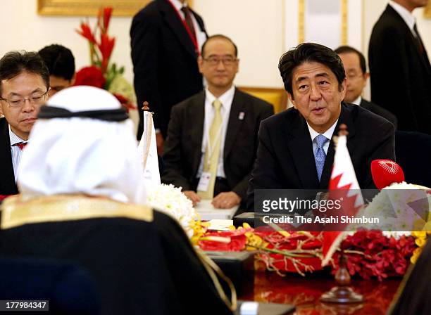 Japanese Prime Minister Shinzo Abe speaks to Bahrain Prime Minister Prince Khalifa bin Salman Al Khalifa during thier meeting at Gudaibiya Palace on...