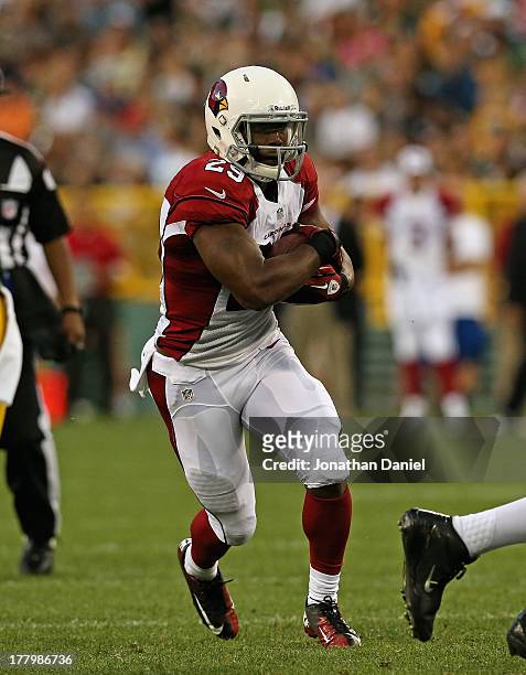 Alfonso Smith of the Arizona Cardinals runs against the Green Bay Packers at Lambeau Field on August 9, 2013 in Green Bay, Wisconsin. The Cardinbals...