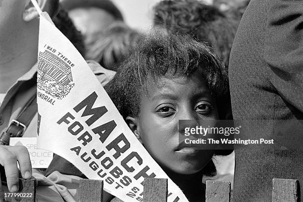 Unique CREDIT: Photo by Rowland Scherman/The US National Archives CUTLINE: A young civil rights demonstrator at the March on Washington for Jobs and...