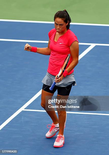 Jamie Hampton of United States of America celebrates the first set point against Lara Arruabarrena of Spain during their first round match on Day One...