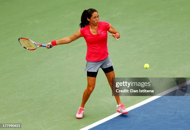 Jamie Hampton of United States of America plays a forehand against Lara Arruabarrena of Spain during their first round match on Day One of the 2013...
