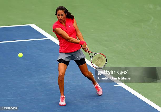 Jamie Hampton of United States of America plays a backhand against Lara Arruabarrena of Spain during their first round match on Day One of the 2013...