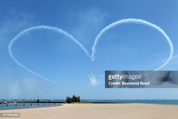 The GEICO Skytypers, performs during the 55th Annual Chicago Air & Water Show over North Avenue Beach in Chicago, Illinois on AUGUST 17 2013.