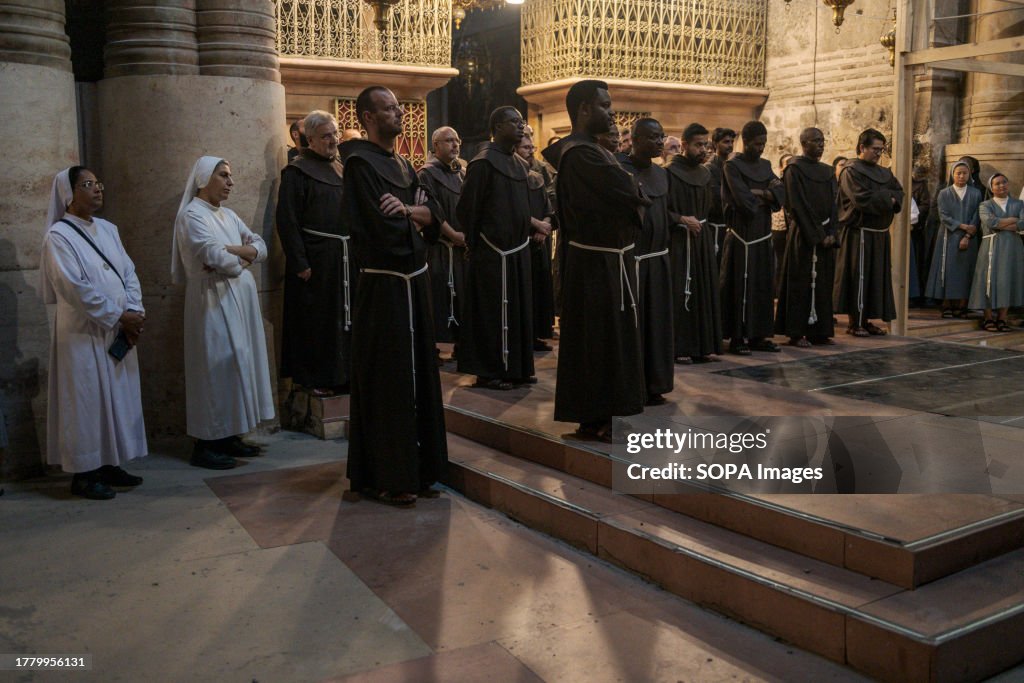 Some friars during a Christian religious celebration inside...