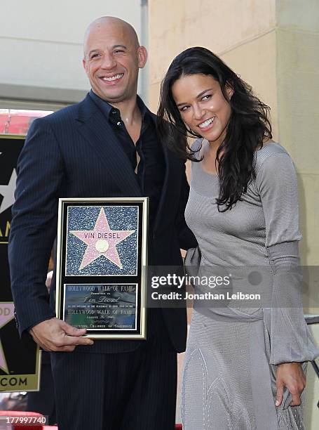 Vin Diesel and Michelle Rodriguez attend the ceremony honoring Vin Diesel with a star on The Hollywood Walk of Fame held on August 26, 2013 in...