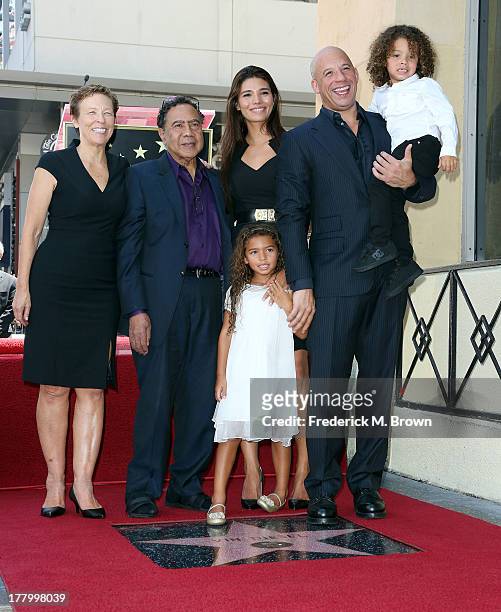 Actor Vin Diesel and his family during the ceremony honoring him on The Hollywood Walk of Fame on August 26, 2013 in Hollywood, California.