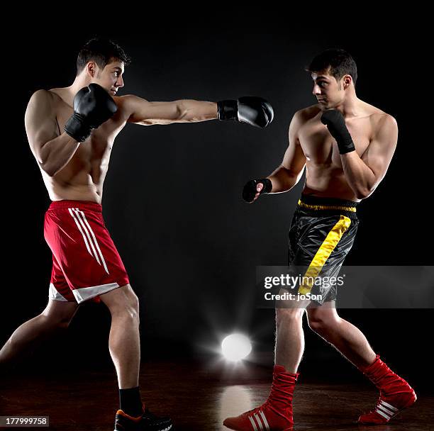 two boxers are fighting with himself - boksbroek stockfoto's en -beelden