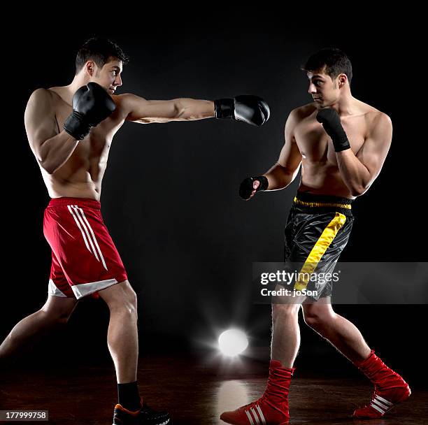 two boxers are fighting with himself - boxing shorts stock pictures, royalty-free photos & images