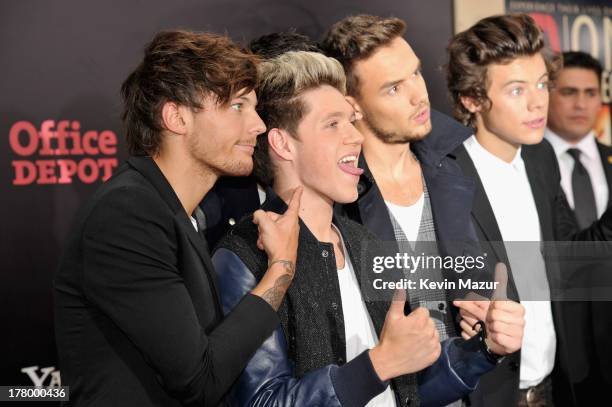 Louis Tomlinson, Niall Horan, Zayn Malik, Liam Payne, and Harry Styles attend the New York premiere of "One Direction: This Is Us" at the Ziegfeld...