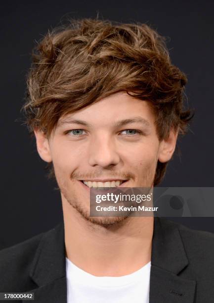 Louis Tomlinson attends the New York premiere of "One Direction: This Is Us" at the Ziegfeld Theater on August 26, 2013 in New York City.