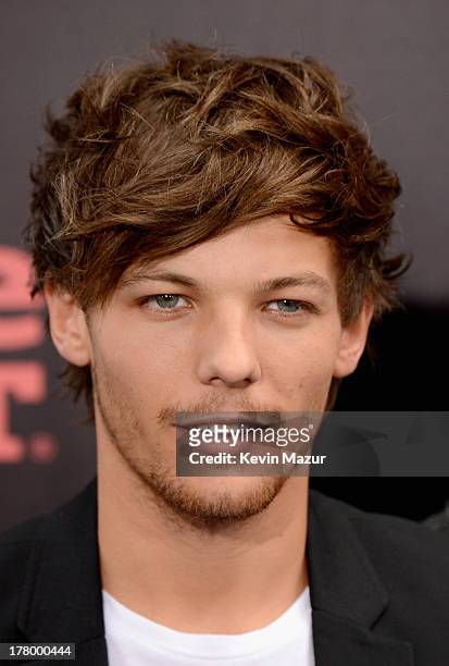 Louis Tomlinson attends the New York premiere of "One Direction: This Is Us" at the Ziegfeld Theater on August 26, 2013 in New York City.
