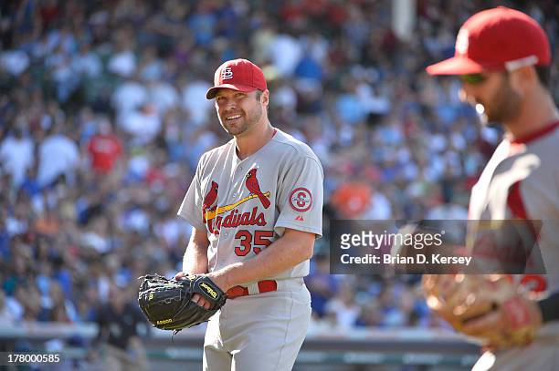 Starting pitcher Jake Westbrook of the St. Louis Cardinals walks off the field against the Chicago Cubs at Wrigley Field on August 16, 2013 in...