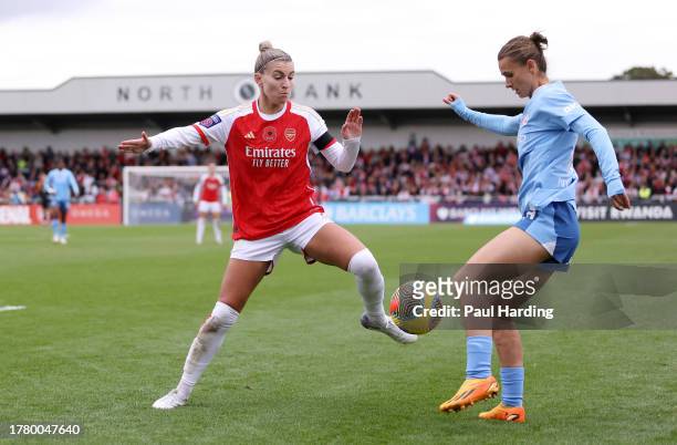 Steph Catley of Arsenal and Kerstin Casparij of Manchester City battle for the ball during the Barclays Women´s Super League match between Arsenal FC...