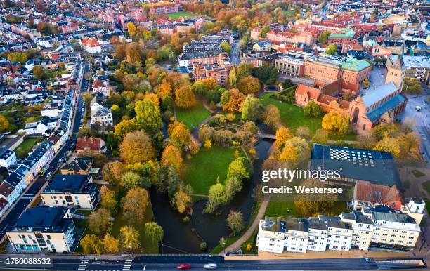 old residential district in odense surrounding public park "eventyrhaven" - "adventure garden" - odense denmark stock pictures, royalty-free photos & images