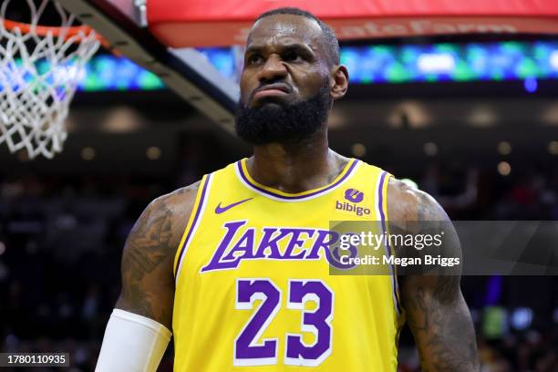 LeBron James of the Los Angeles Lakers reacts after being fouled against the Miami Heat during the first quarter of the game at Kaseya Center on...