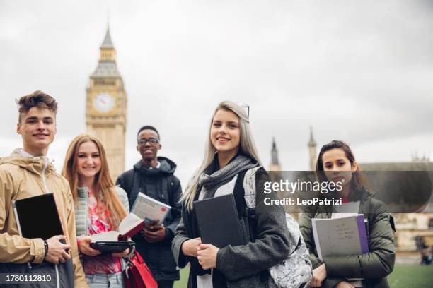 group of multi ethnic english students - school holiday stock pictures, royalty-free photos & images