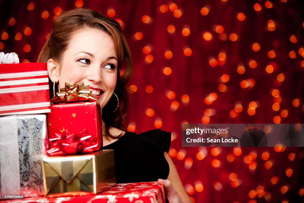 Christmas: Woman Behind Stack of Gifts