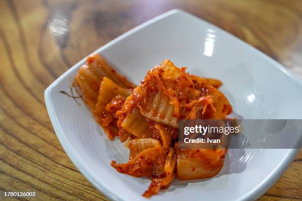 vegetable pickles or traditional korean kimchi - south korea v japan stock pictures, royalty-free photos & images