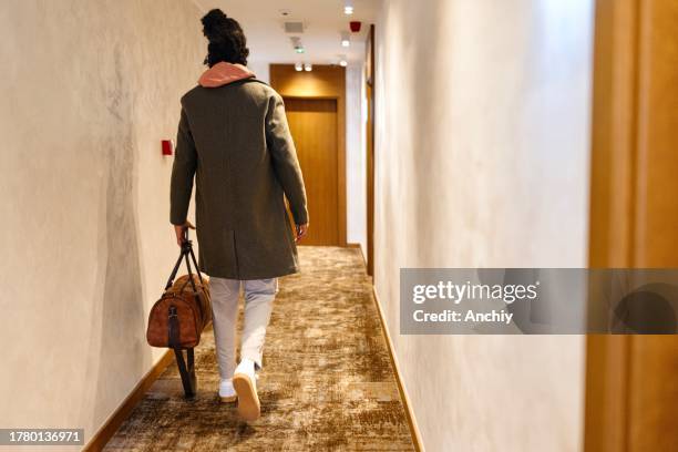 hispanic man going to his hotel room - keycard access stock pictures, royalty-free photos & images