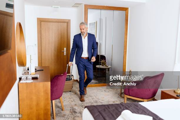 a man enters his room in a luxury hotel - keycard access stock pictures, royalty-free photos & images