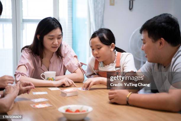 the three generations family board game time - yuting stock pictures, royalty-free photos & images