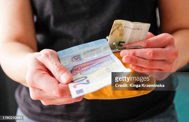 paper currency - euro in hand stock pictures, royalty-free photos & images