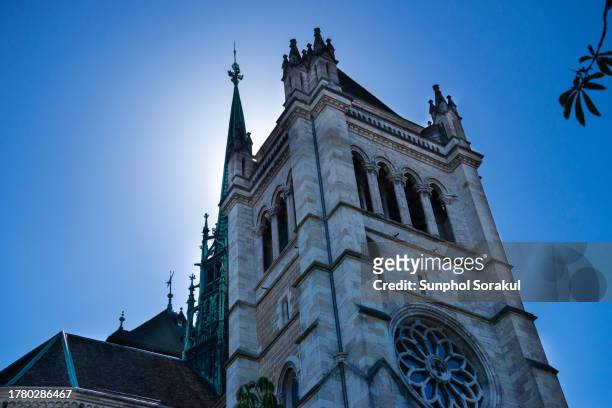 bell tower on the back exterior of st pierre cathedral, geneva, switzerland - st pierre cathedral geneva stock pictures, royalty-free photos & images