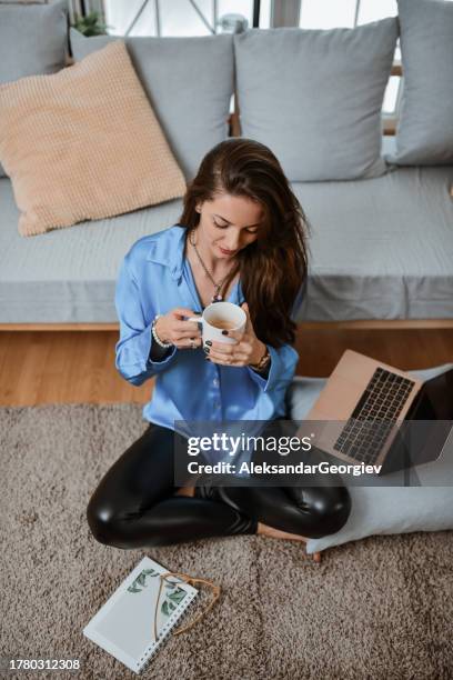 coffee time and drawing for female relaxing on floor - time life authors stock pictures, royalty-free photos & images