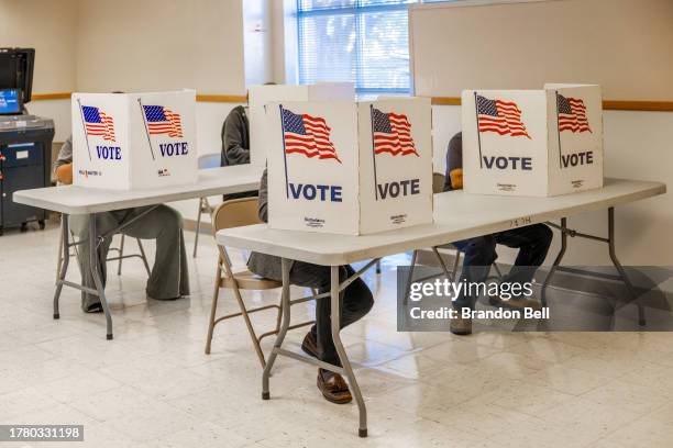 Voters fill out their ballots at the U.S. Air Force MEPS Liaison building on November 07, 2023 in Jackson, Mississippi. After months of candidates...