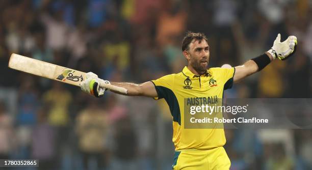 Glenn Maxwell of Australia celebrates after hitting a six for the winning runs, finishing unbeten on 201 not out during the ICC Men's Cricket World...