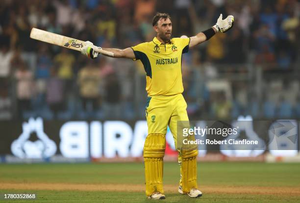 Glenn Maxwell of Australia celebrates after hitting a six for the winning runs, finishing unbeten on 201 not out during the ICC Men's Cricket World...