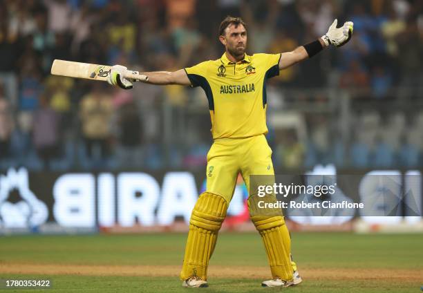 Glenn Maxwell of Australia celebrates after hitting a six for the winning runs, finishing unbeten on 201 not out during the ICC Men's Cricket World...