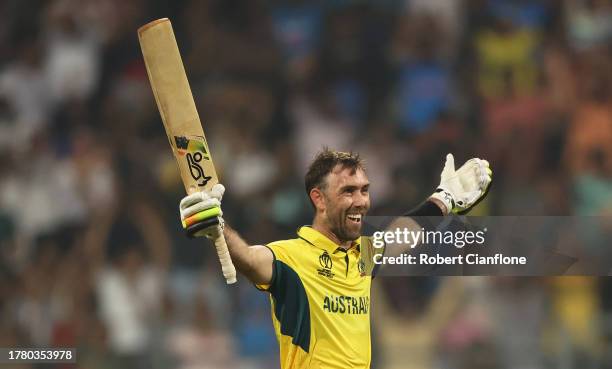 Glenn Maxwell of Australia celebrates after hitting a six for the winning runs, finishing unbeten on 201 not out during the ICC Men's Cricket World...