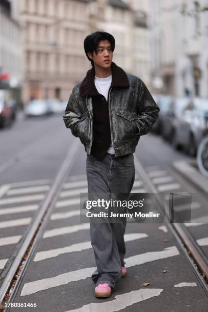 Bao Tran seen wearing Diesel grey/black distressed leather pilot jacket, COS brown wool knit cardigan jacket, Weekday white cotton t-shirt, Calvin...