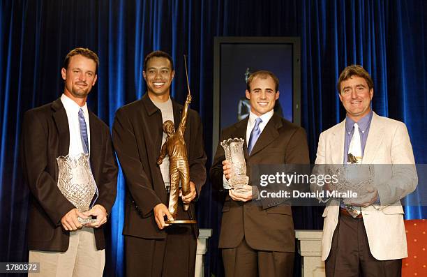 Patrick Moore holds the NationWide Tour Player of the Year Trophy, Tiger Woods holds the Jack Nicklaus PGA Player of the Year Trophy, Jonathan Byrd...