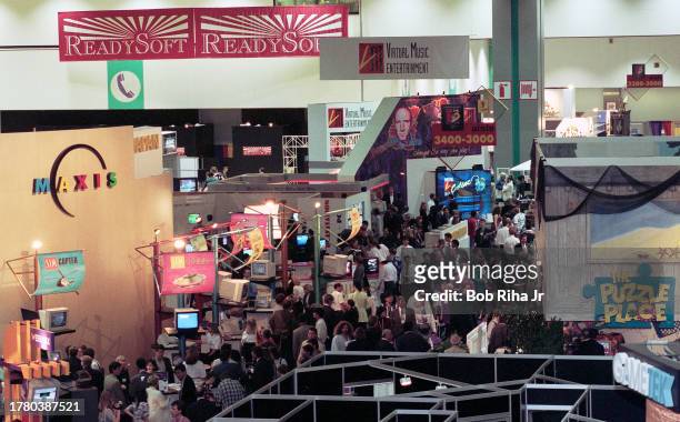 Video gamers walk among many displays and vendors at the Electronic Entertainment Expo , May 16, 1996 in Los Angeles, California.
