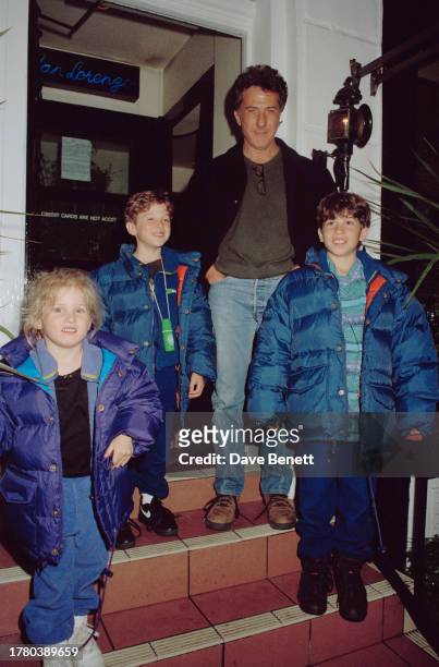 The American actor Dustin Hoffman and his children leaving the San Lorenzo restaurant, London, 26th March 1992.