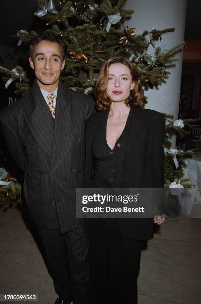 British singer-songwriter Andrew Ridgeley and English singer Keren Woodward attend a party at the Design Museum, London, 8th December 1993.