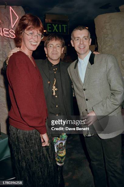 British broadcaster Janet Street-Porter, British singer Elton John, and British musician Neil Tennant attend a party at Planet Hollwood for the...