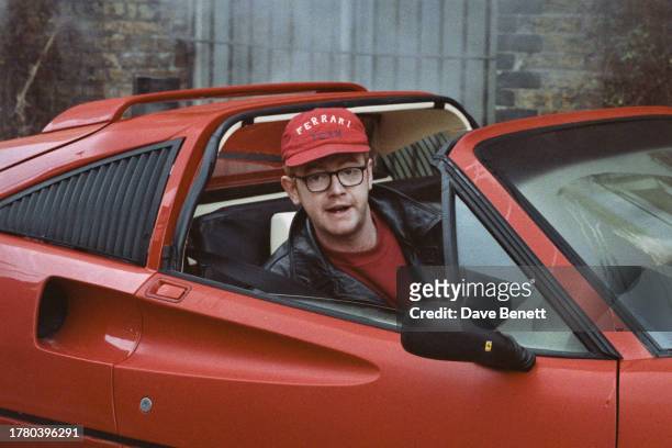 English television presenter and radio DJ Chris Evans driving a Ferrari car in the Docklands area of London, January 1994.