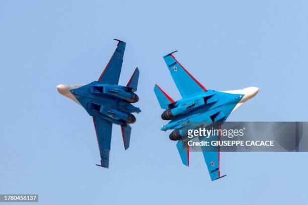 Russian Air Force aerobatic team the 'Russian Knights' perform during the 2023 Dubai Airshow at Dubai World Central - Al-Maktoum International...